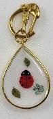 Porte clé coccinelle contour doré
