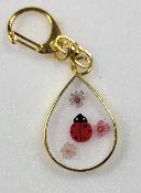 Porte clé coccinelle contour doré